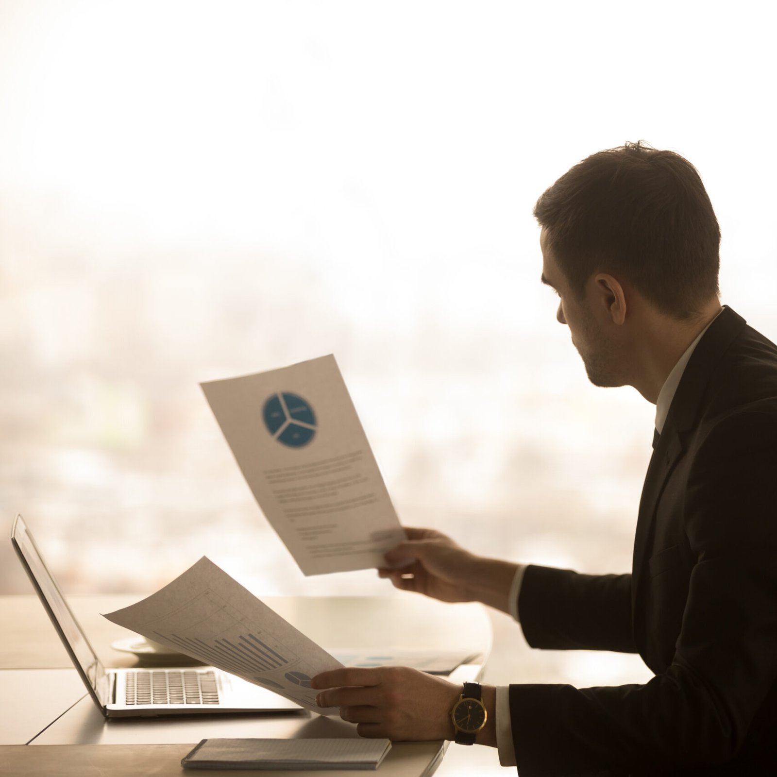 https://www.grantts.com/wp-content/uploads/2025/05/entrepreneur-analyzing-business-stats-documents-scaled-e1746429295693.jpg